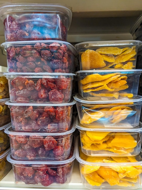 Dried fruits in the store freezedried cherries and mangoes in plastic containers