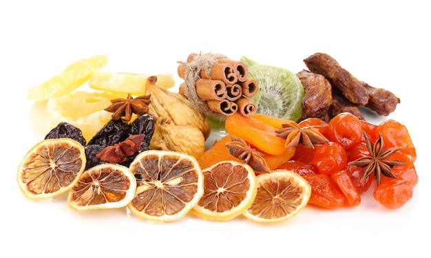 Dried fruits with cinnamon and anise stars on white