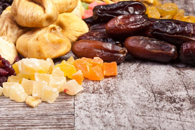 Dried fruits on wooden background