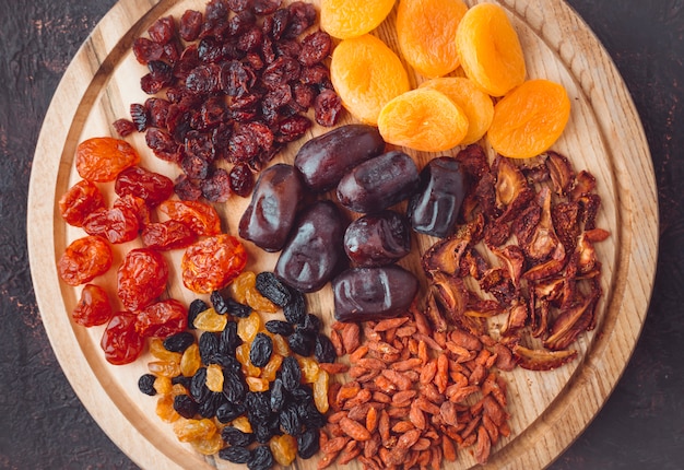 Dried fruits on a wooden board