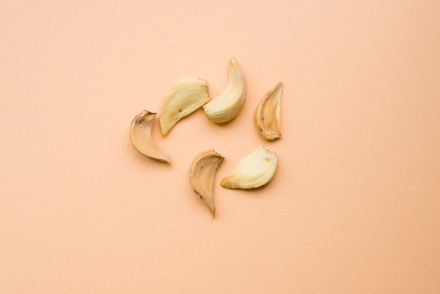 Dried garlic on cream background