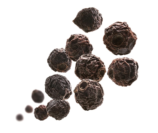 Dried hawthorn berries levitate on a white background