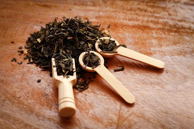 Dried herbal tea in a wooden spoon