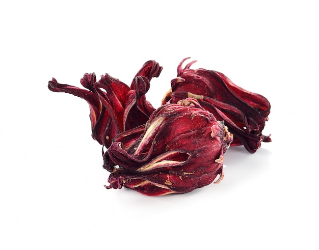 Dried hibiscus sabdariffa or roselle fruits on white.