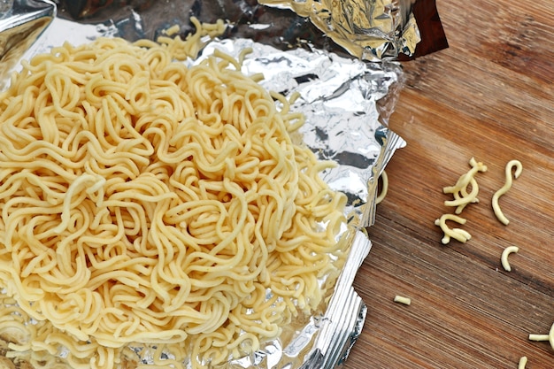 dried instant noodles on wooden