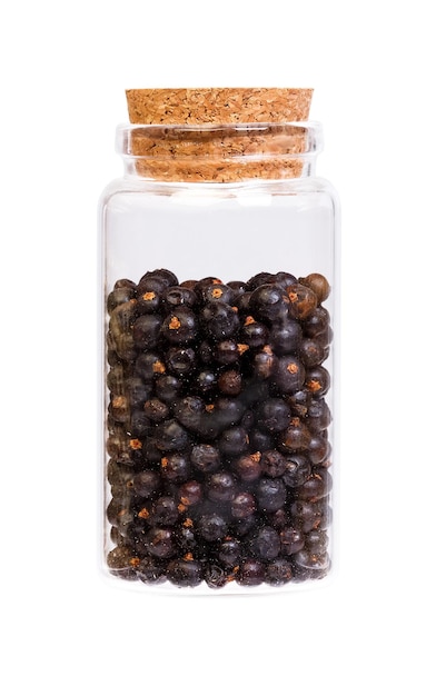 Dried Juniper berries in a bottle with cork stopper for medical