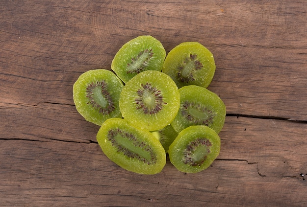 Dried kiwi on wooden background