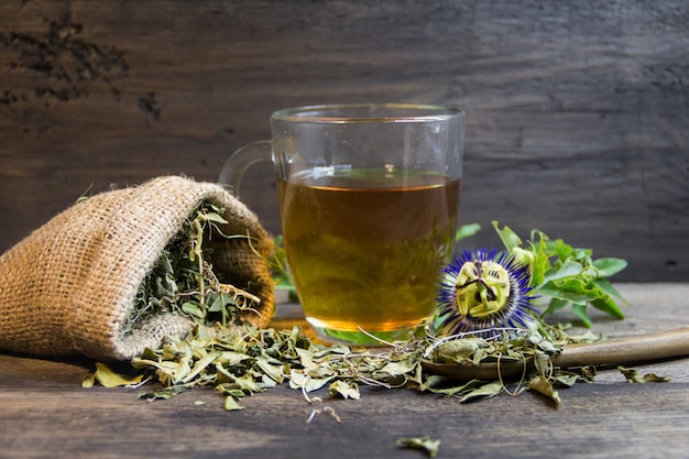 Dried leaves of passiflora to drink sedative tea on wood background