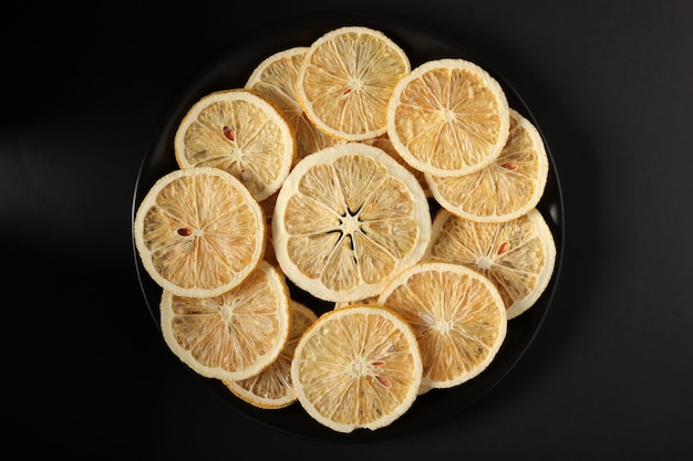 Dried lemon slices in a black plate