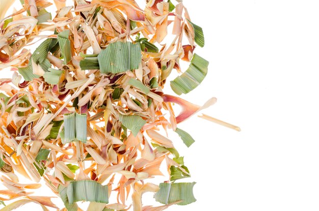 Dried lemongrass herb with pandanus on white surface