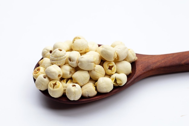 Dried lotus seeds on white background