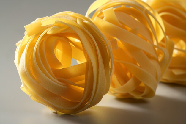 Dried macro noodles yellow pasta, studio shot