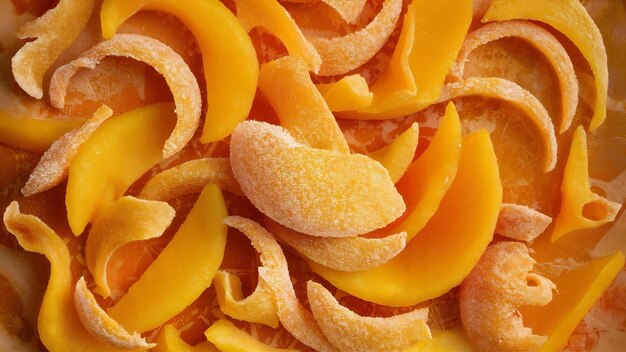 Dried mango background candied slices of mango fruit close up