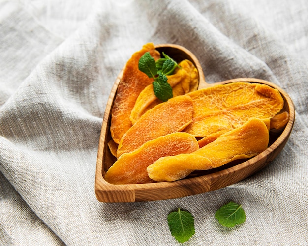 Dried Mango Fruit on grey textile Background