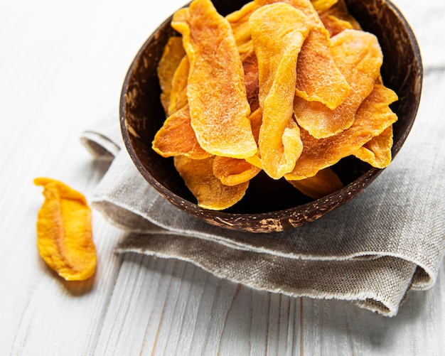 Dried Mango Fruit on Old Wooden Background