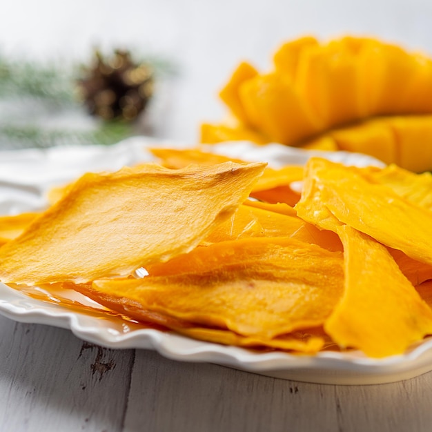 Dried Mango lay on the white plate.