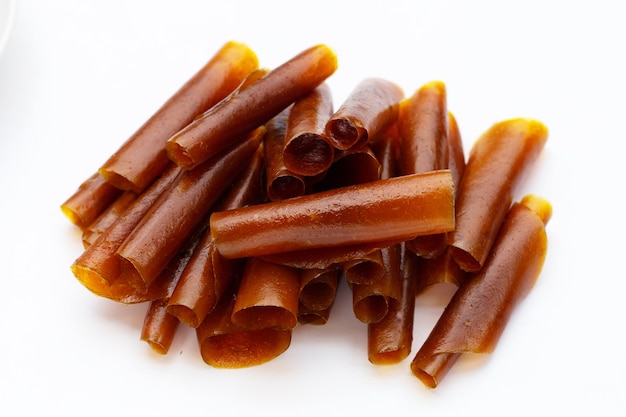 dried mango paste sheets on white background