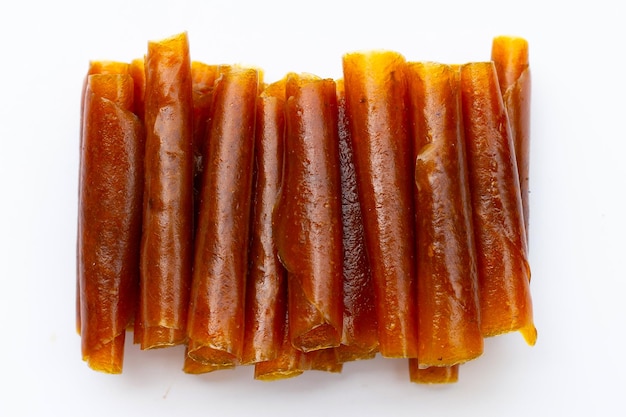 dried mango paste sheets on white background