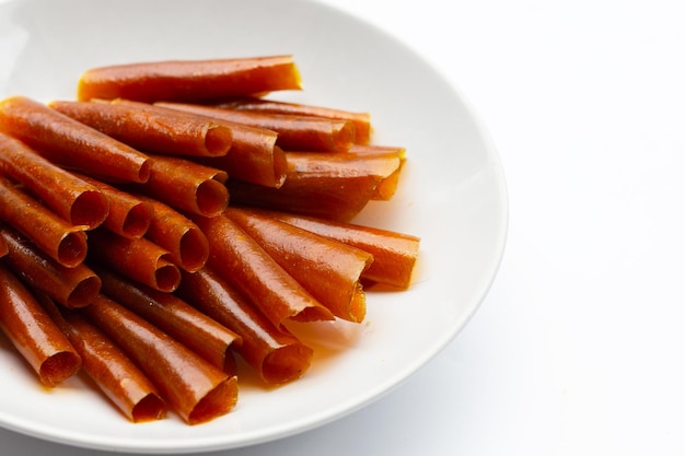 dried mango paste sheets on white background