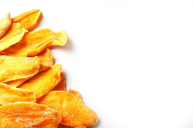 Dried mango sliced on a white background with free space