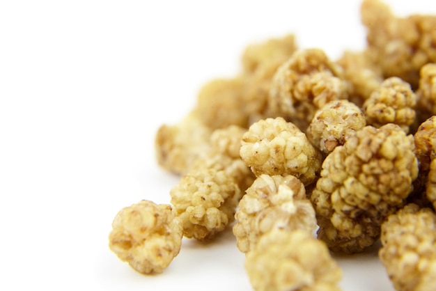 Dried mulberry on white background Dry sweet berries morus alba closeup