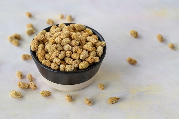 Dried mulberry on wooden background kuru dut