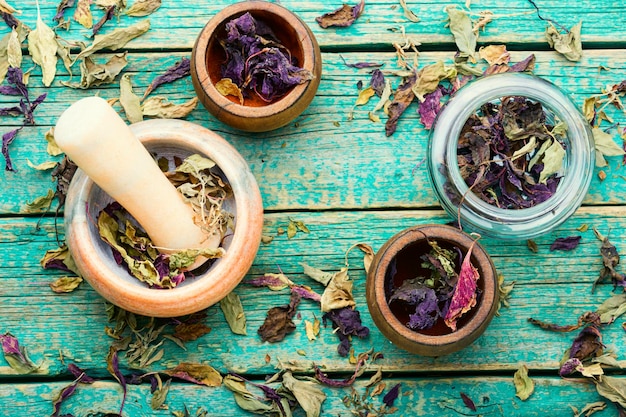 Dried natural basil spice in jars and mortar