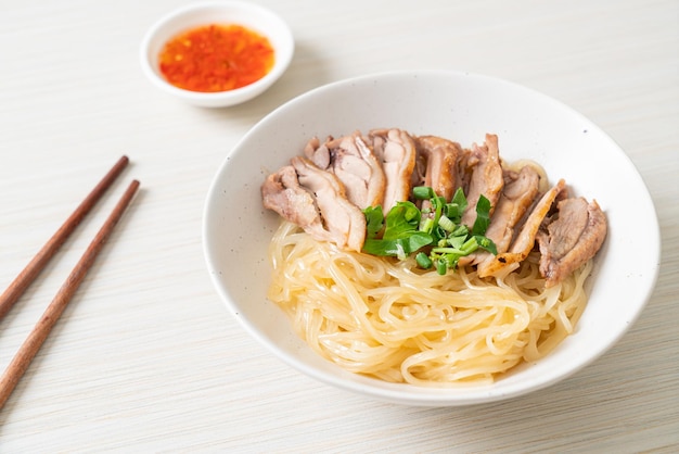 dried noodles with stewed duck in white bowl - Asian food style