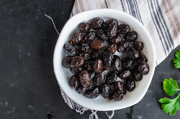 Dried olives sundried aromatic dry fruit appetizer or salad addition healthy food meal snack