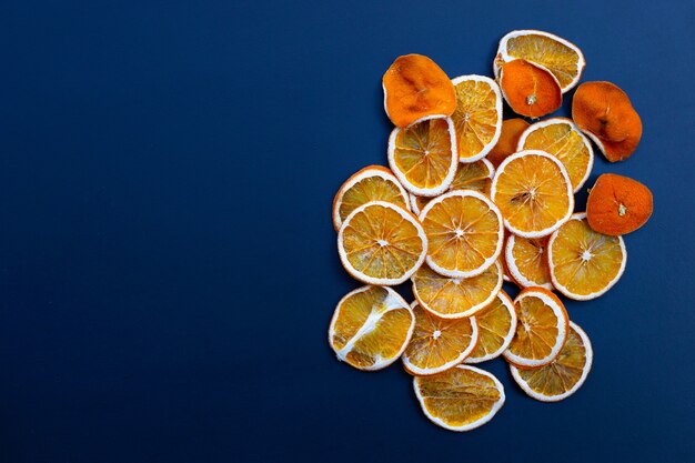 Dried orange slices on blue