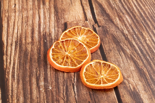 Dried orange slices for decoration on a wooden table