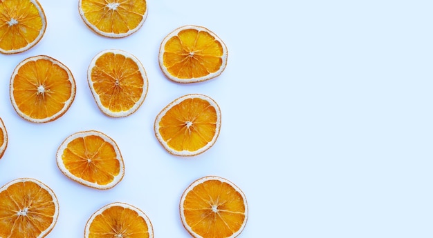 Dried orange slices on white surface