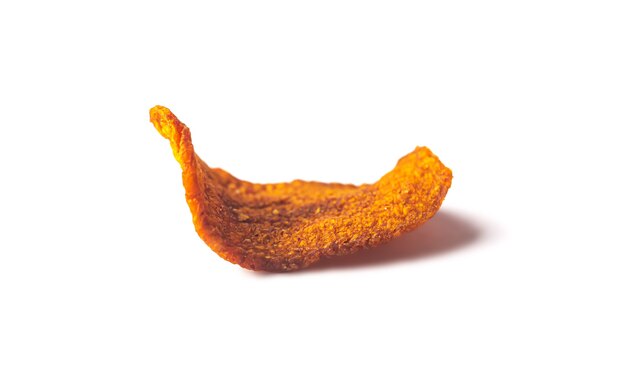 Dried organic carrot chip isolated with shadow