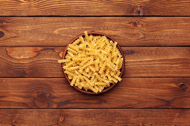 Dried pasta on wooden 