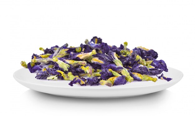 Dried pea flowers on a white plate