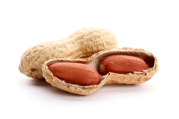 Dried peanuts on the white background. Top view. close-up.