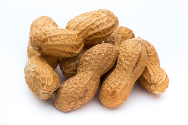 Dried peanuts on the white background.