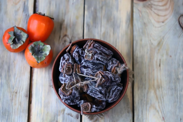 Dried persimmon in a bowl Autumn fruits Dried fruits