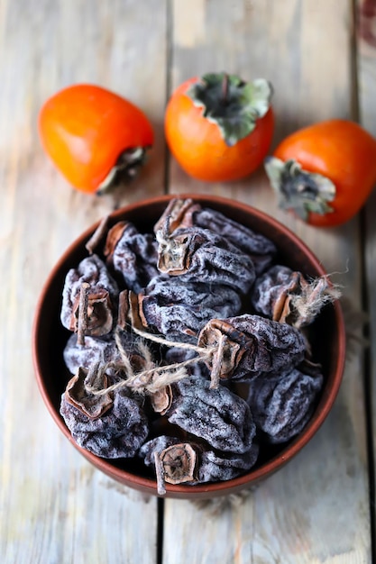 Dried persimmon in a bowl Autumn fruits Dried fruits