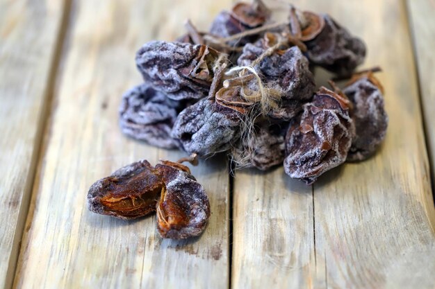 Dried persimmon on a wooden surface Close