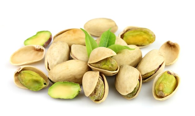 Dried pistachios on a white background