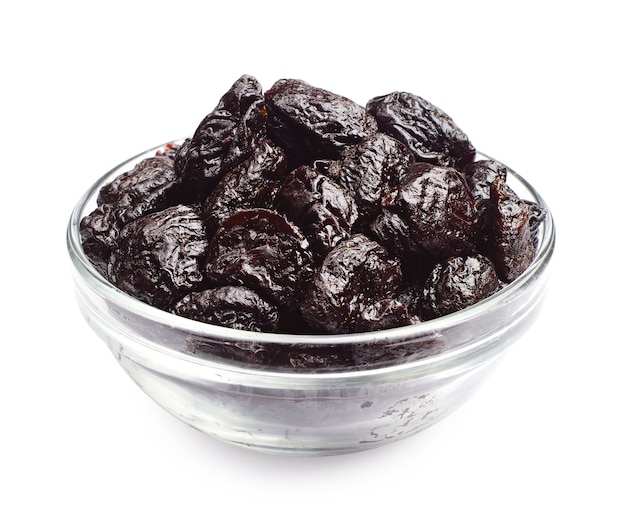 Dried plum in a glass bowl on a white background