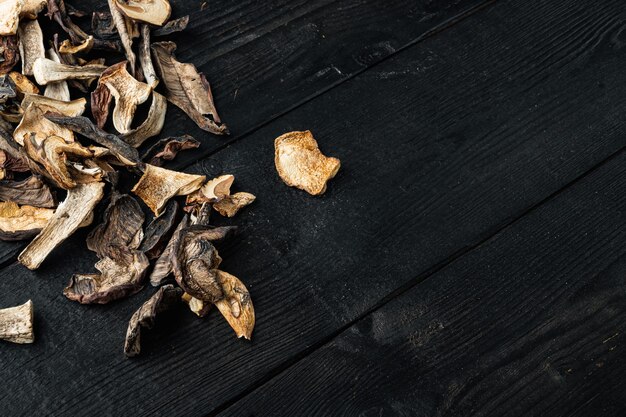 dried porcini mushrooms set, on black wooden table