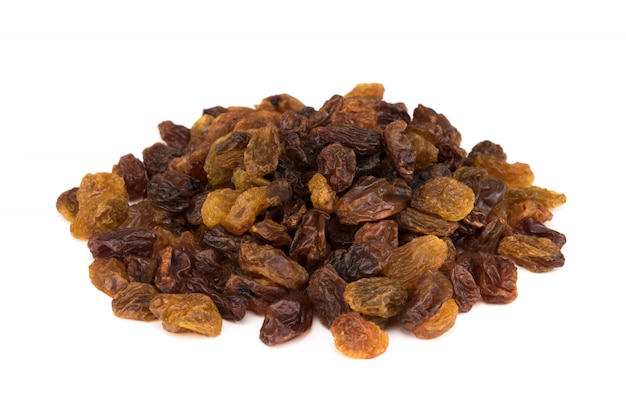 Dried raisins isolated on white.