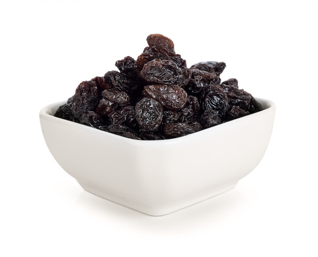 Dried raisins on white.