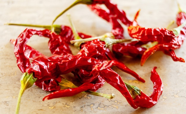 Dried red chili pepper on wooden background