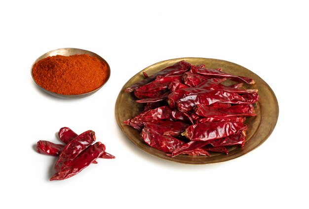 Dried Red Chili Peppers with Chili Powder on White Background