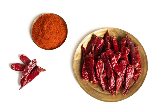 Dried Red Chili Peppers with Chili Powder on White Background