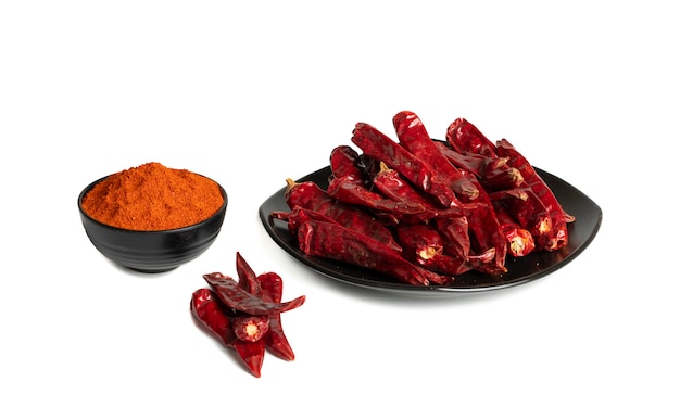 Dried Red Chili Peppers with Chili Powder on White Background