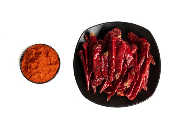 Dried Red Chili Peppers with Chili Powder on White Background